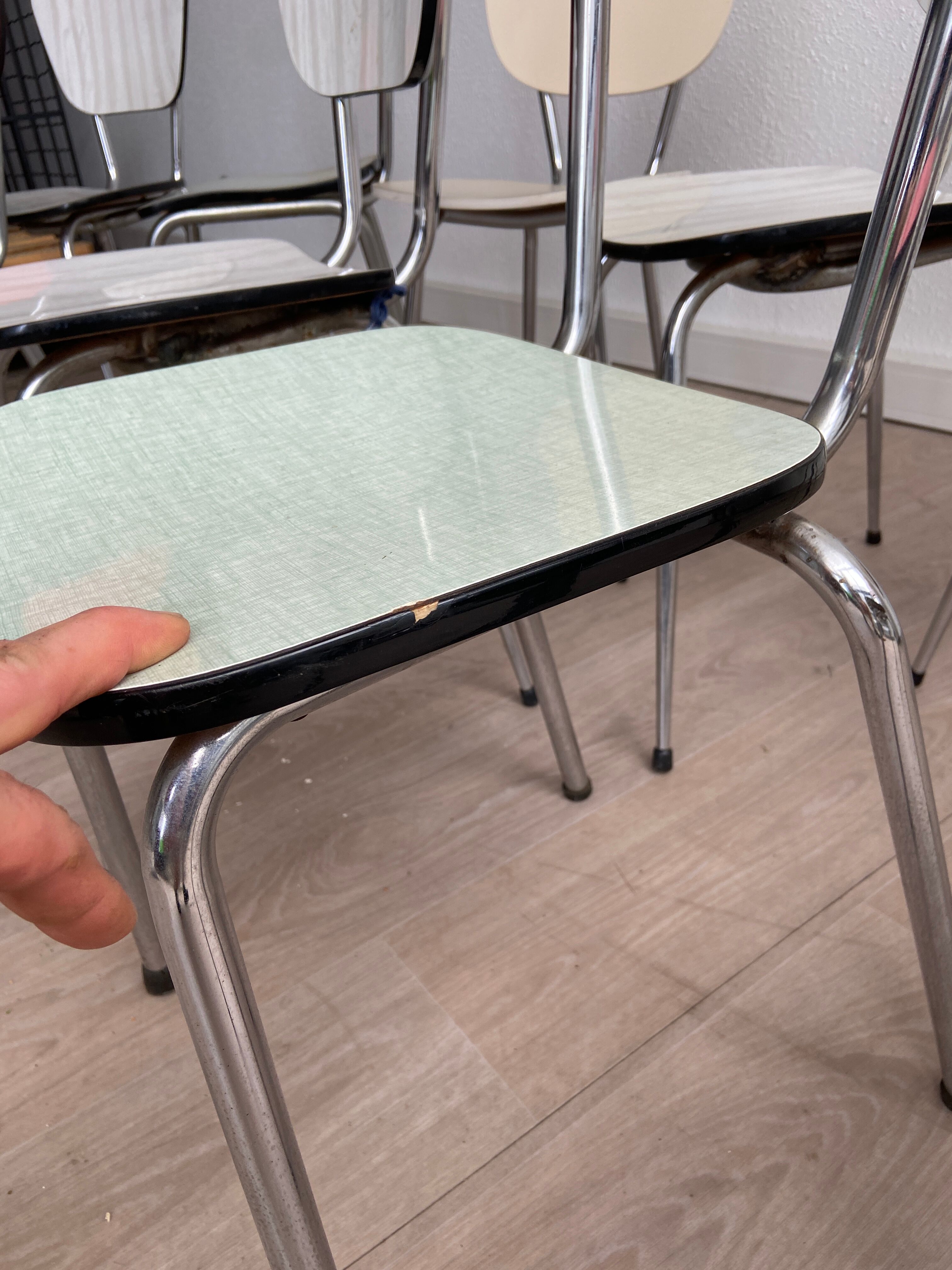 10 mismatched multicolored Formica chairs 60s