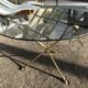 Glass and brass coffee table with hoof-shaped tripod legs, 1970