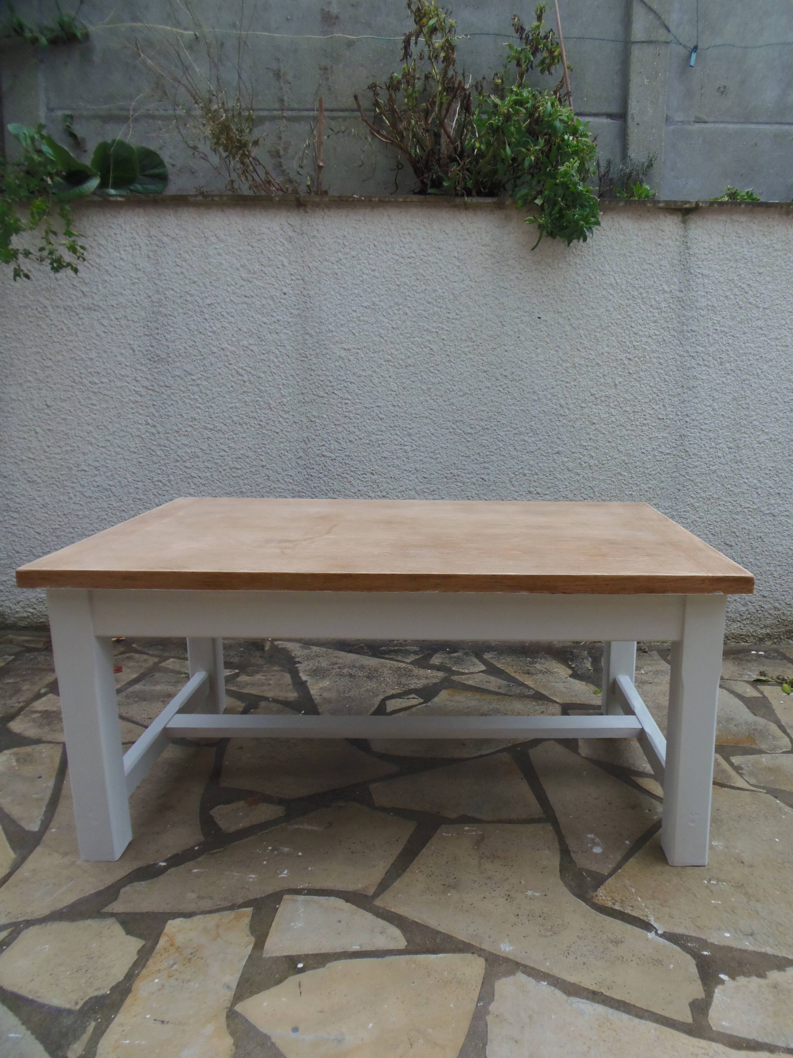 Coffee table with pearl grey legs and a wooden top.