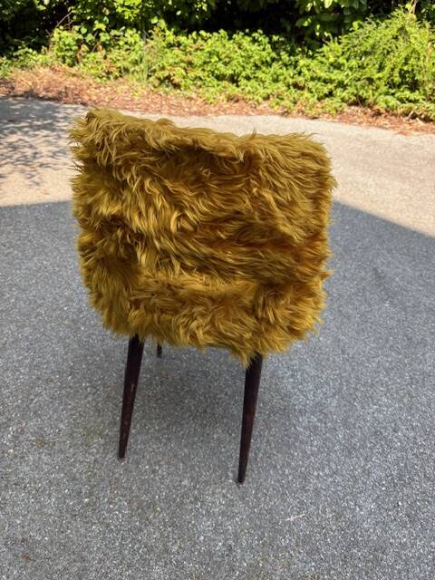 Old mustard furry armchair