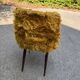 Old mustard furry armchair
