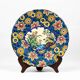 Assiette Longwy 1930 – Émaux à décor d’oiseaux et fleurs oranges