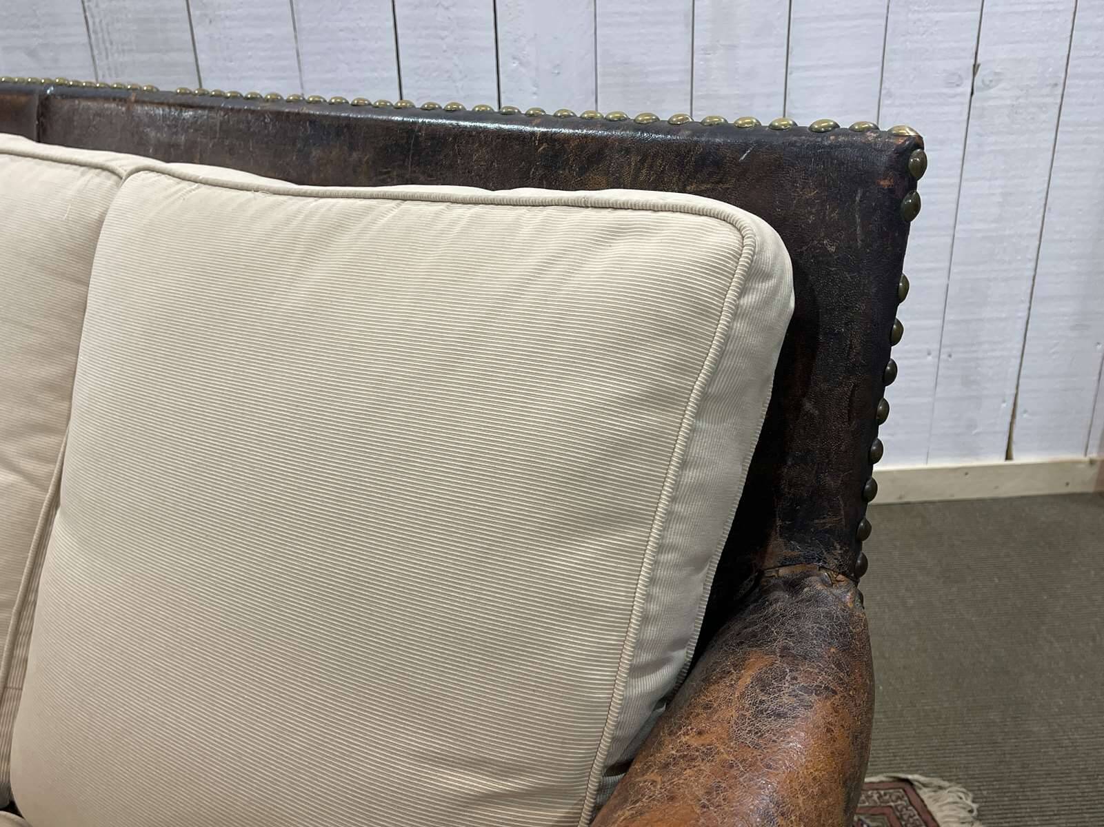 Early 20th century leather club sofa - seat and back in modern fabric