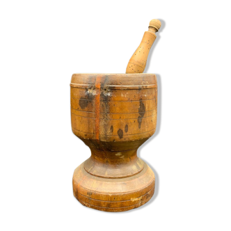 Ancient Mortar and its frutier wooden pestle shot from the 19th century, France