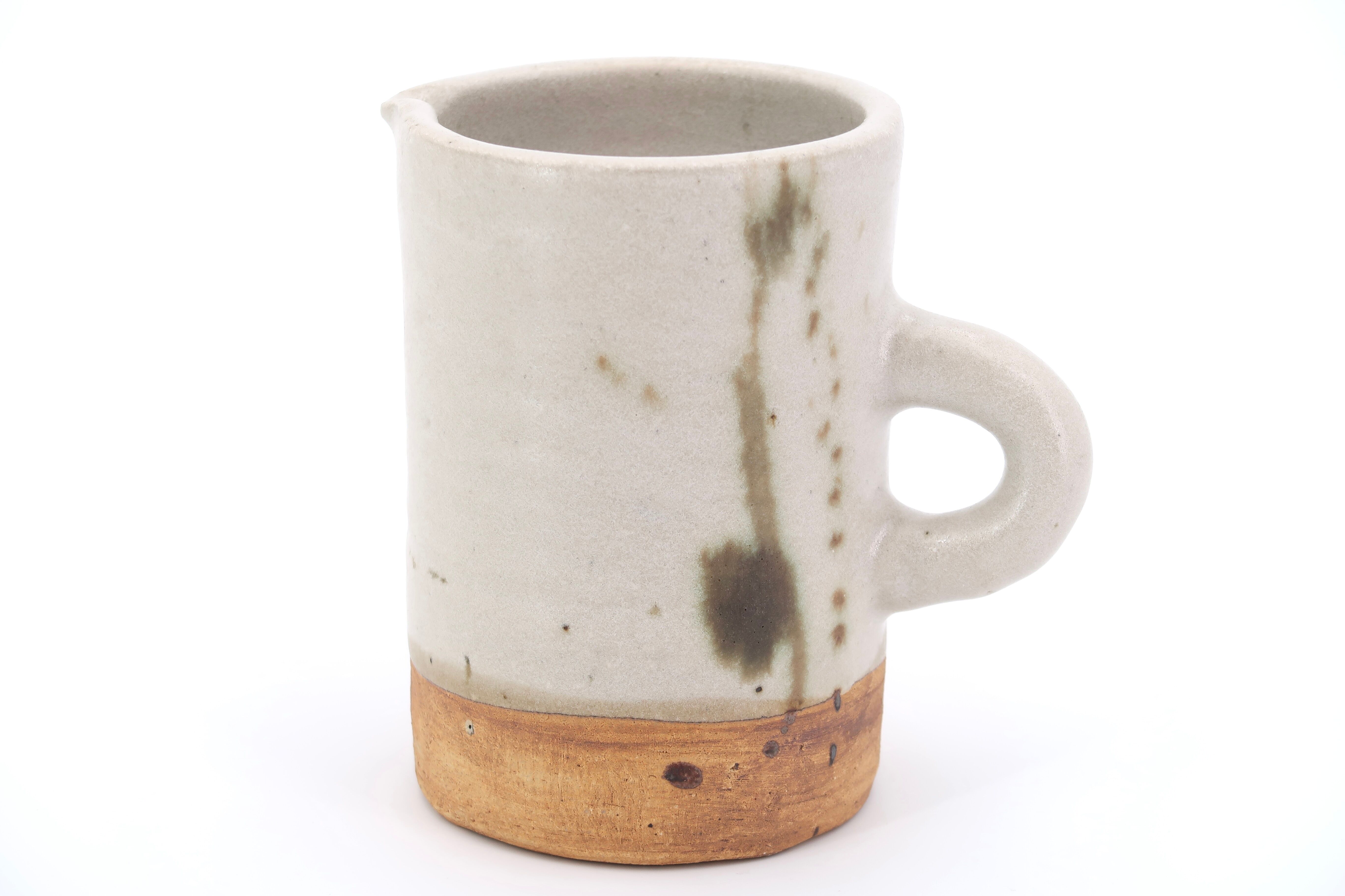 Two ceramic pitchers from the Dove pottery