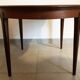 Round dining table with Scandinavian and Danish design in extendable teak from the 60s
