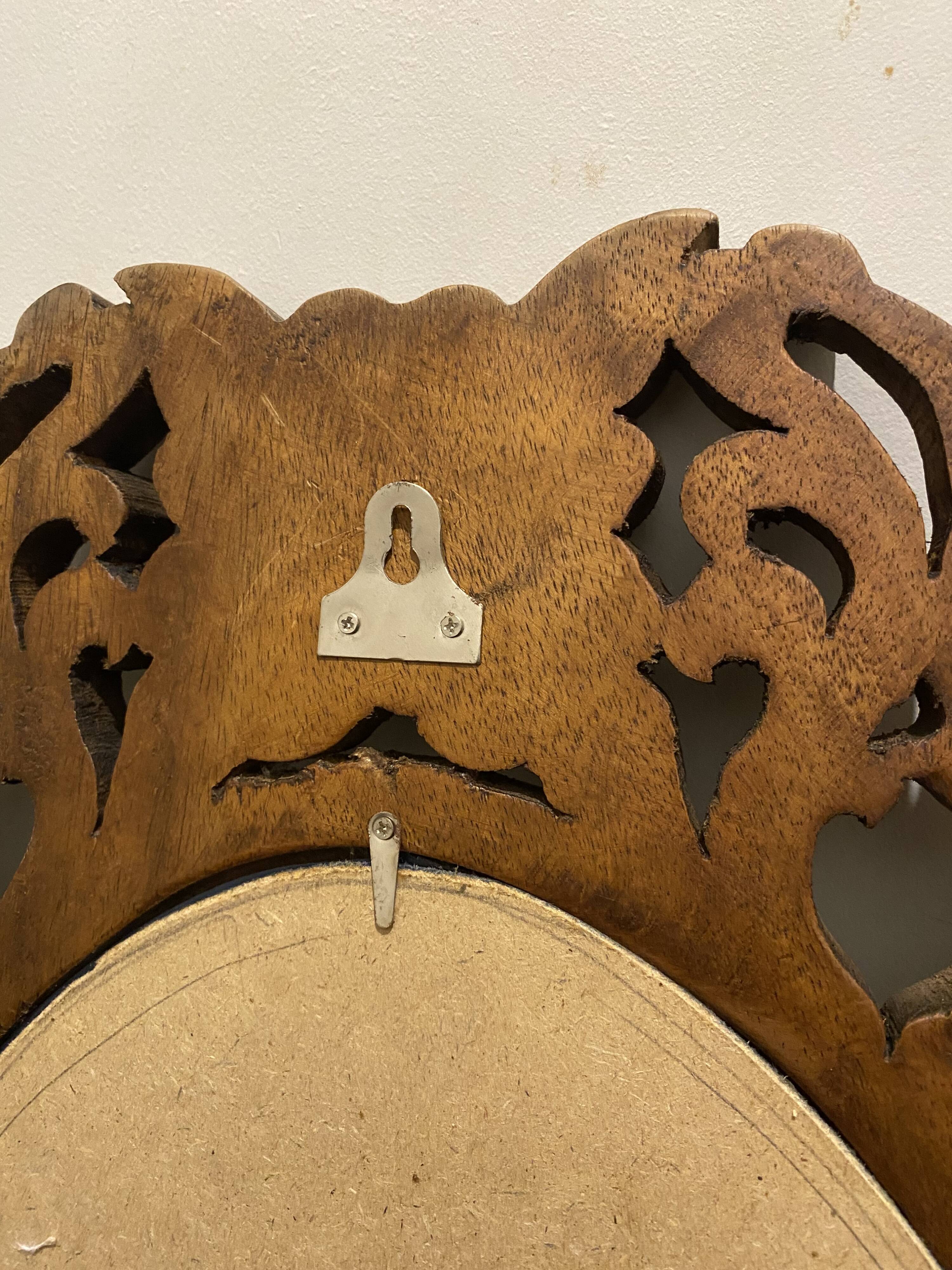 Carved mirror with integrated shelf