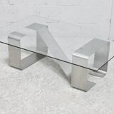 Coffee table with "kinetic" steel base and glass slab. Circa 1970.