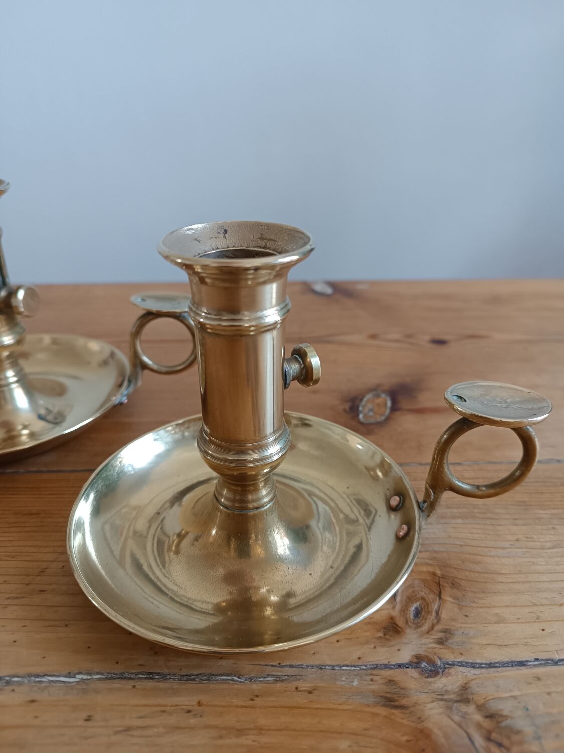 Duo of gilded brass cellar rat candlesticks