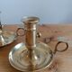Duo of gilded brass cellar rat candlesticks