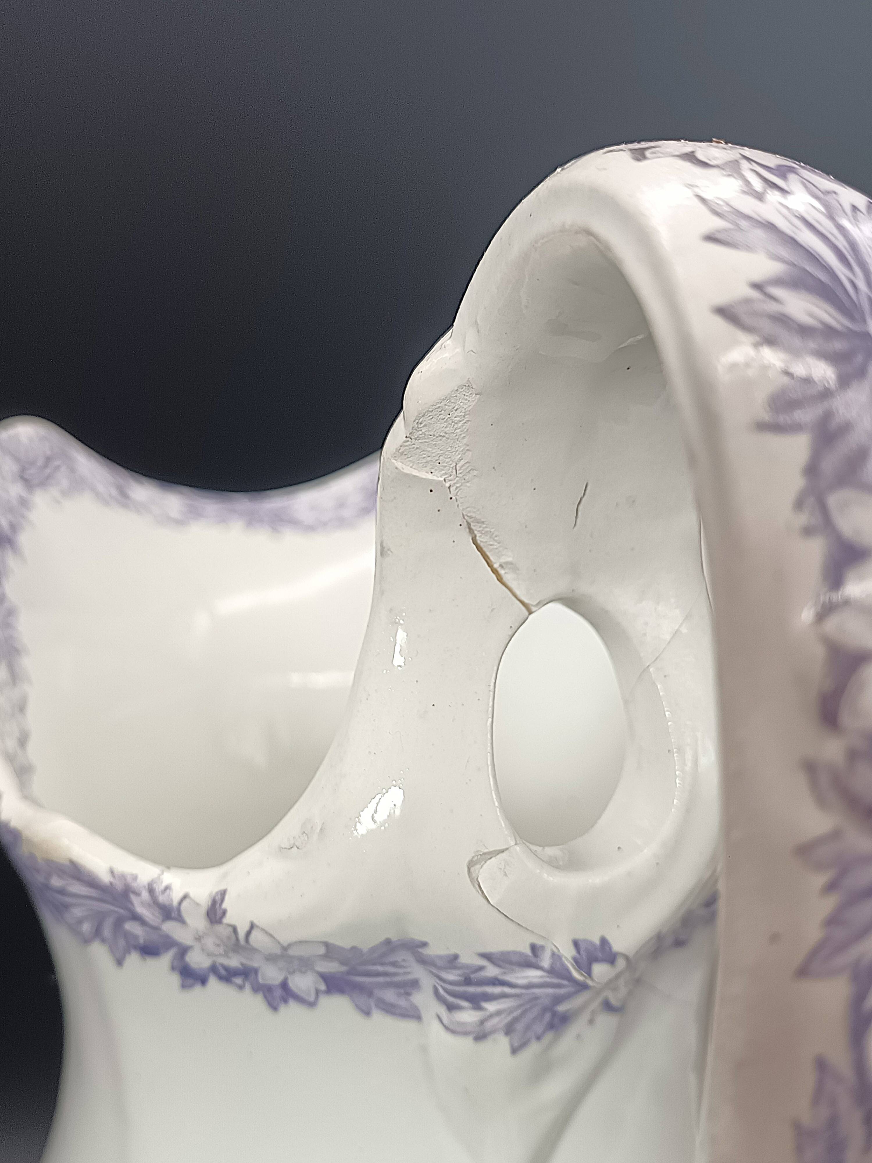 Large antique toilet bowl by Jules Vieillard Bordeaux with violet floral decoration.