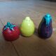 Trio salt shakers pepper vegetables and fruits in slip