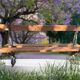 Antique double garden bench from the city of Paris in cast iron and wood