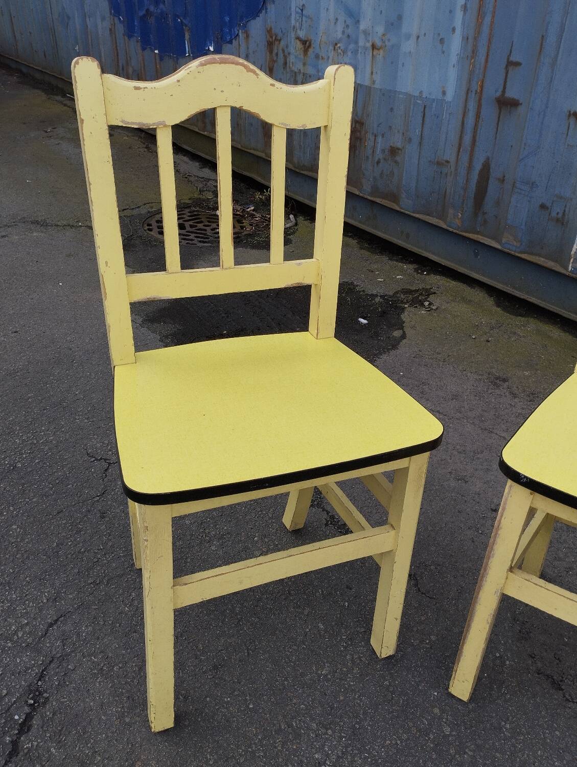 Pair of wooden and yellow formica chairs