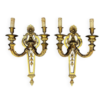 Large pair of gilt bronze wall sconces in the Louis XVI style.