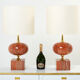 Pair of lamps in red travertine and brass 1970