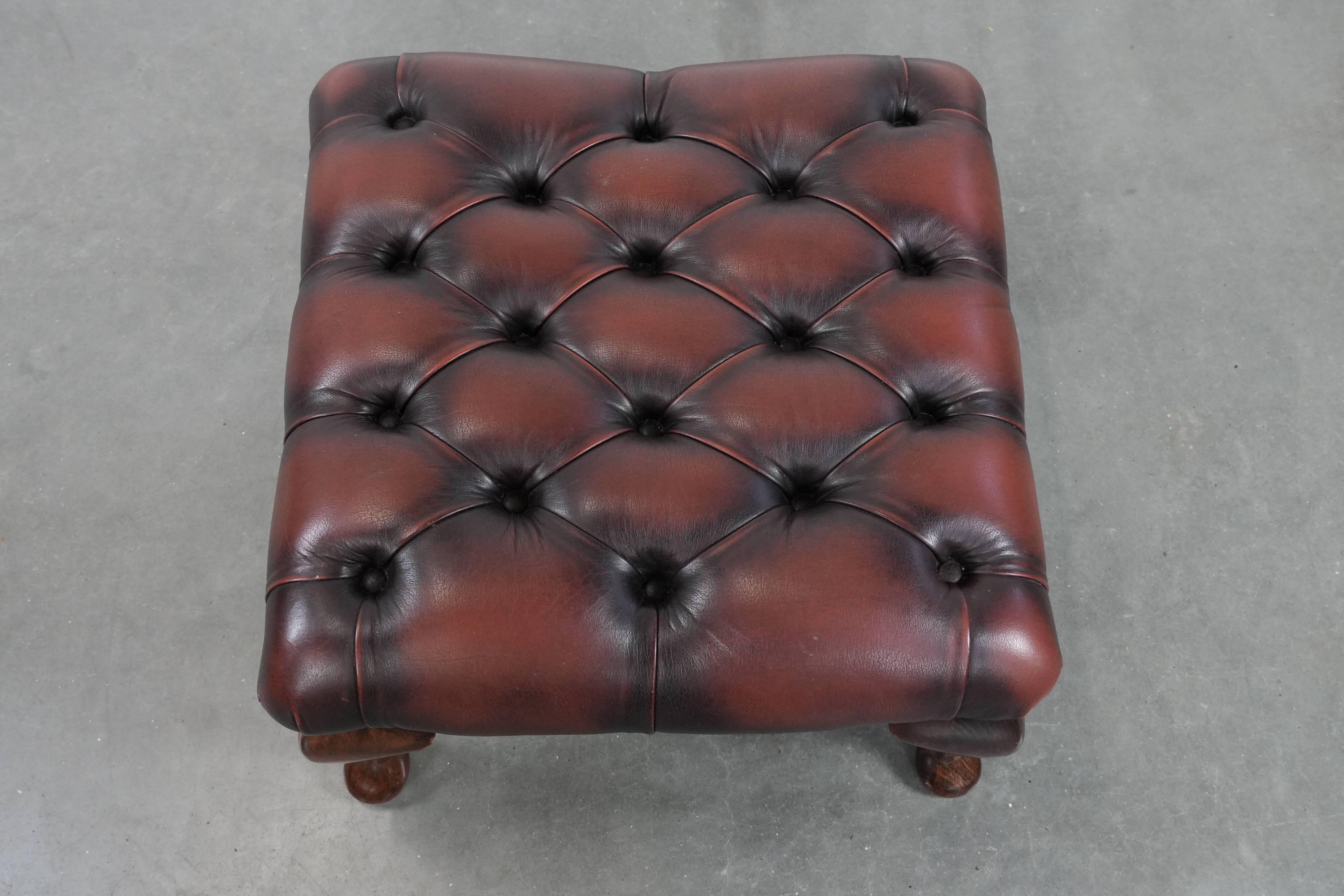 Dark brown chesterfield ottoman in cowhide leather