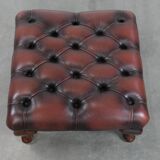 Dark brown chesterfield ottoman in cowhide leather