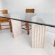 Dining table in travertine and glass with sculpted legs, 1970s.