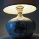 Glazed ceramic ball lamp signed Bossis with a fabric shade.