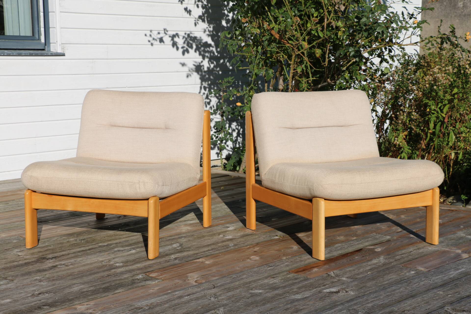 Pair of wood and fabric lounge chairs, 1980