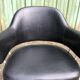 Pair of vintage armchairs in black skai with metal legs.