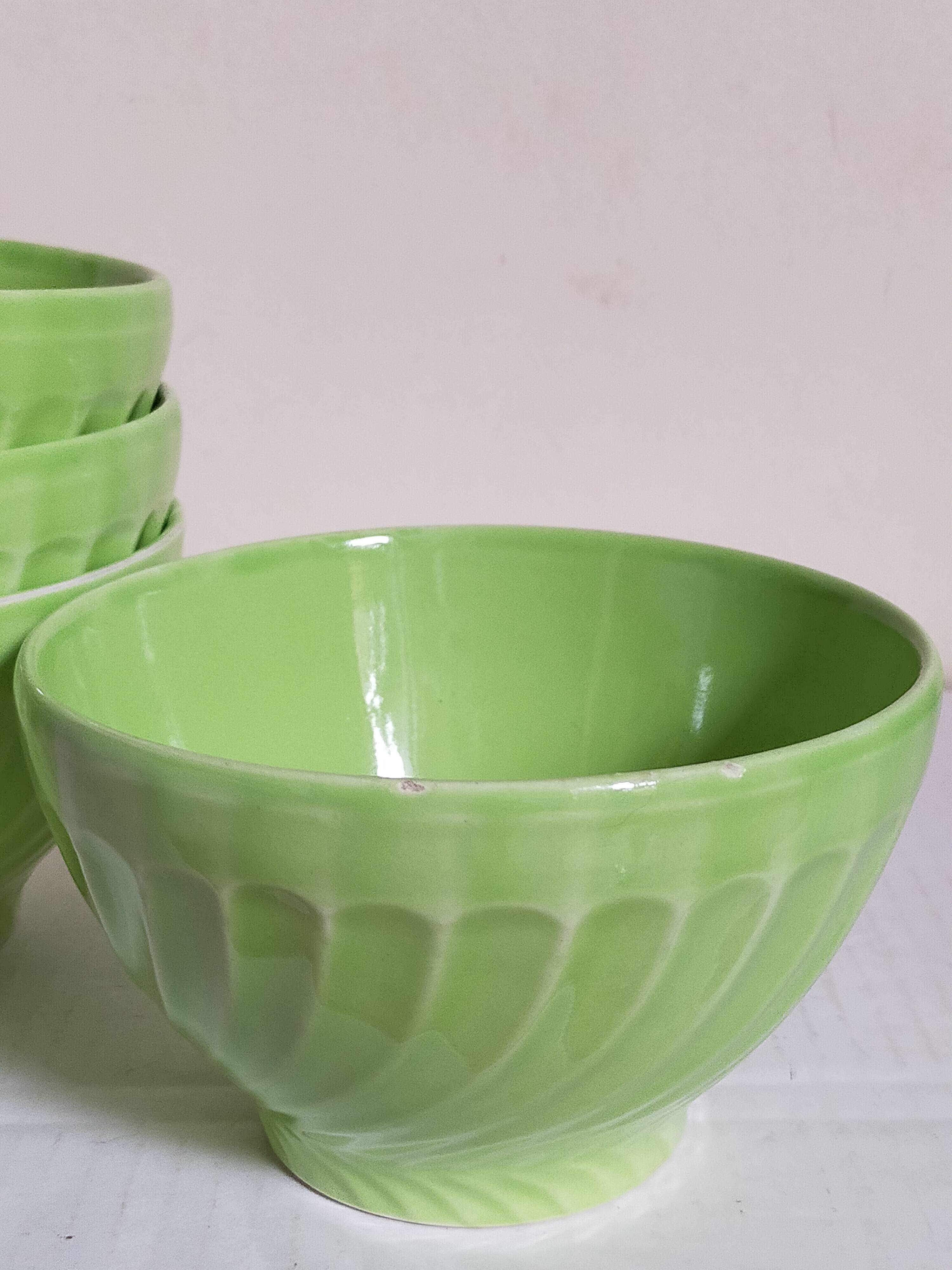 Four vintage spring green earthenware bowls
