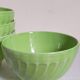 Four vintage spring green earthenware bowls