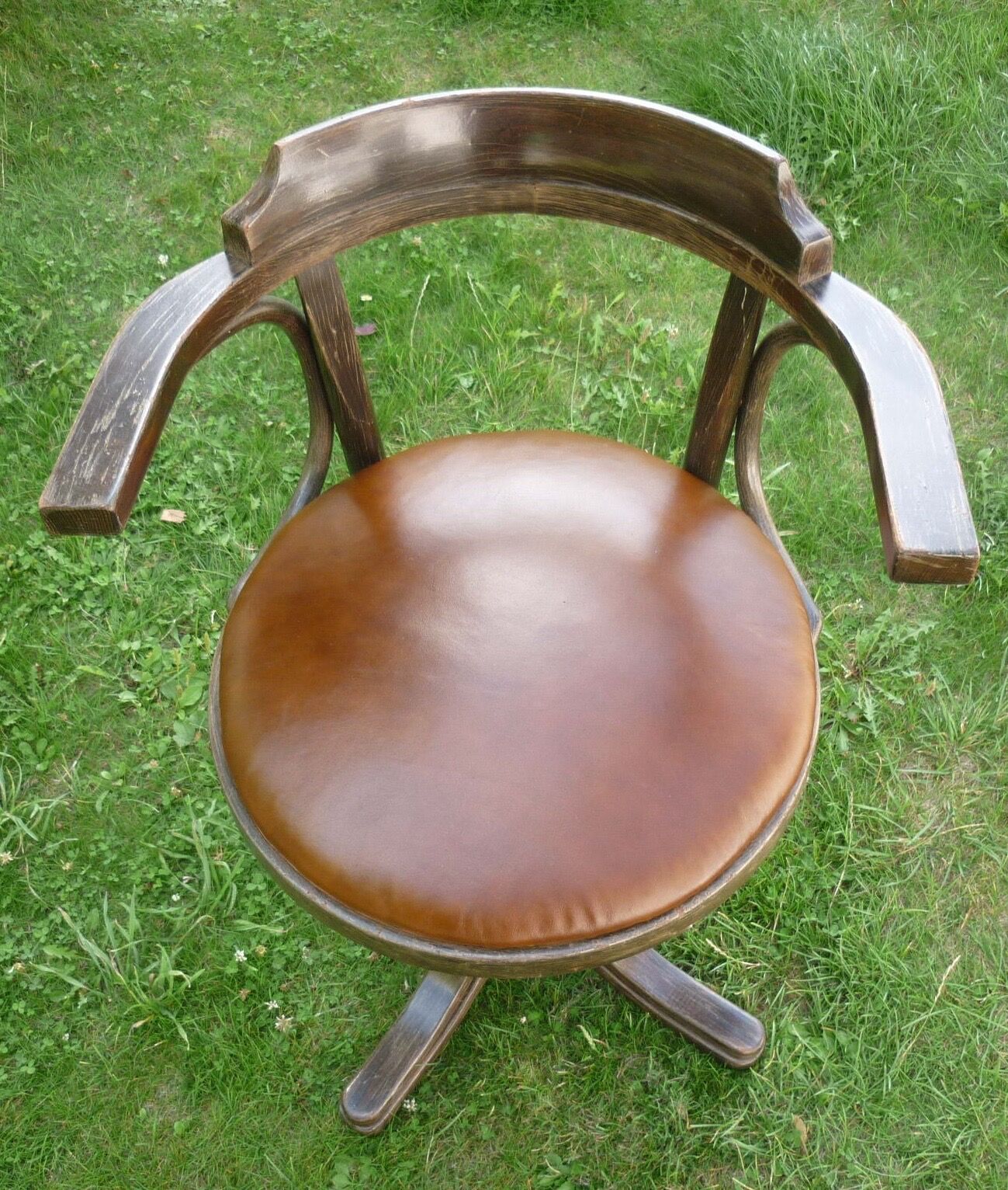 Swivel leather armchair