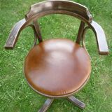 Swivel leather armchair