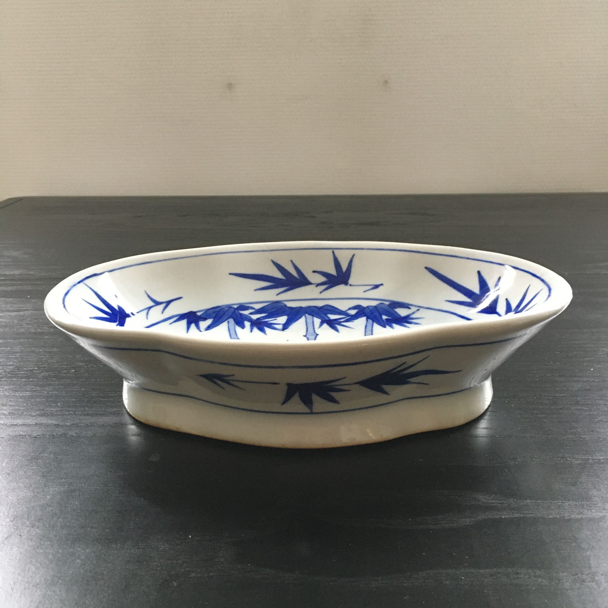 Chinese cup decorated with blue bamboo.
