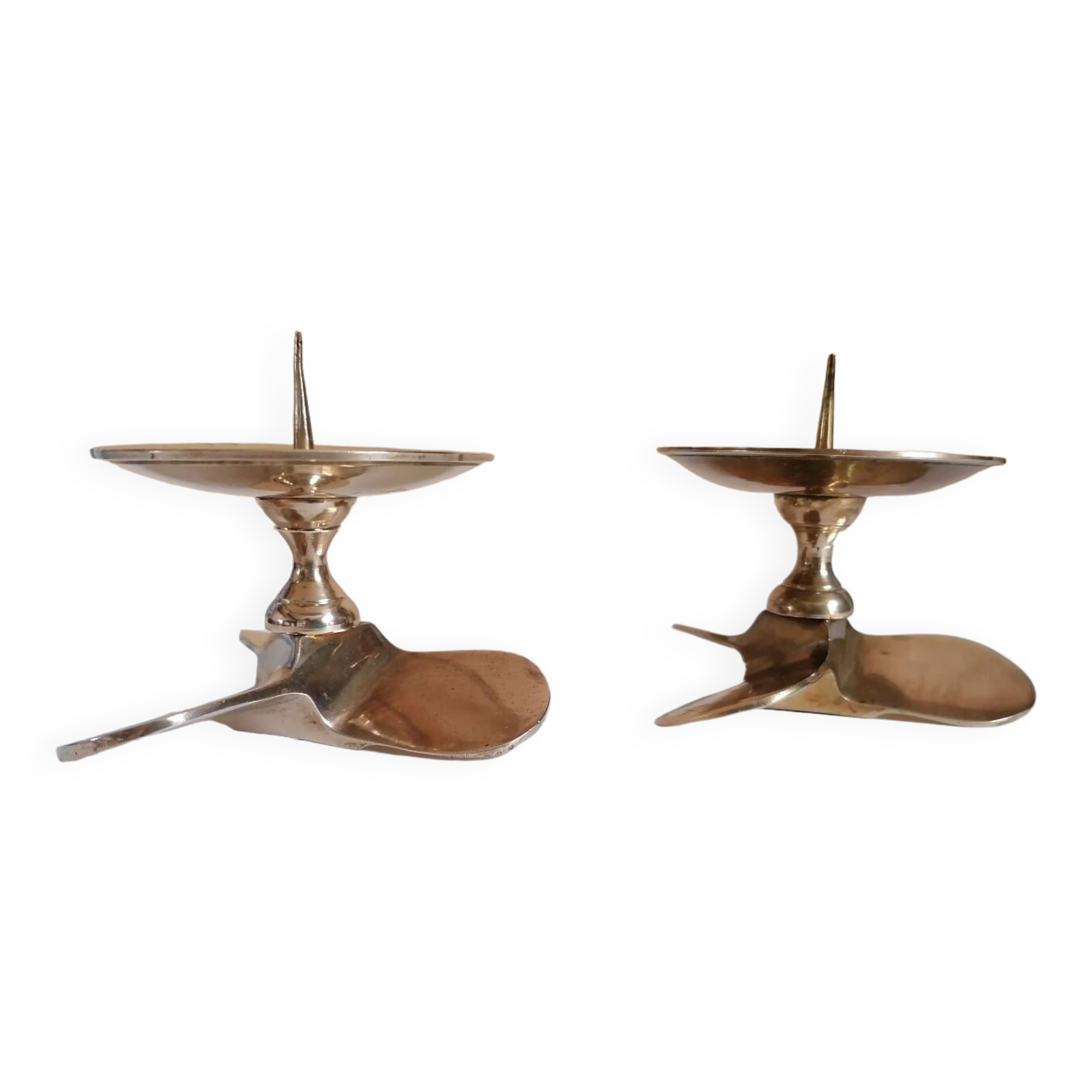Two brass aviation propeller candle holders
