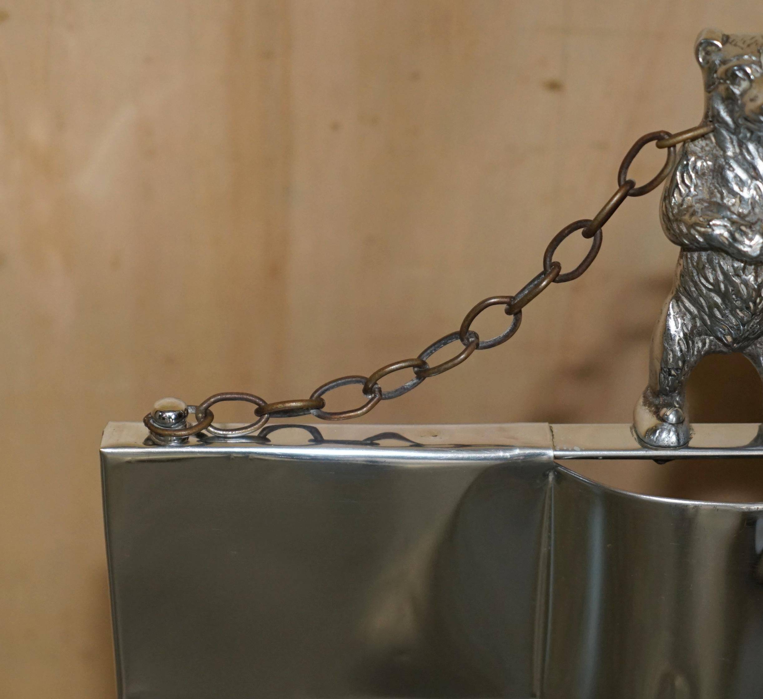 Art Deco fire screen from around 1920 in polished chrome with a bear.