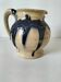 handcrafted ceramic jug with navy blue drip glaze.