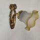 Antique wall light in gilded brass and glass tulip