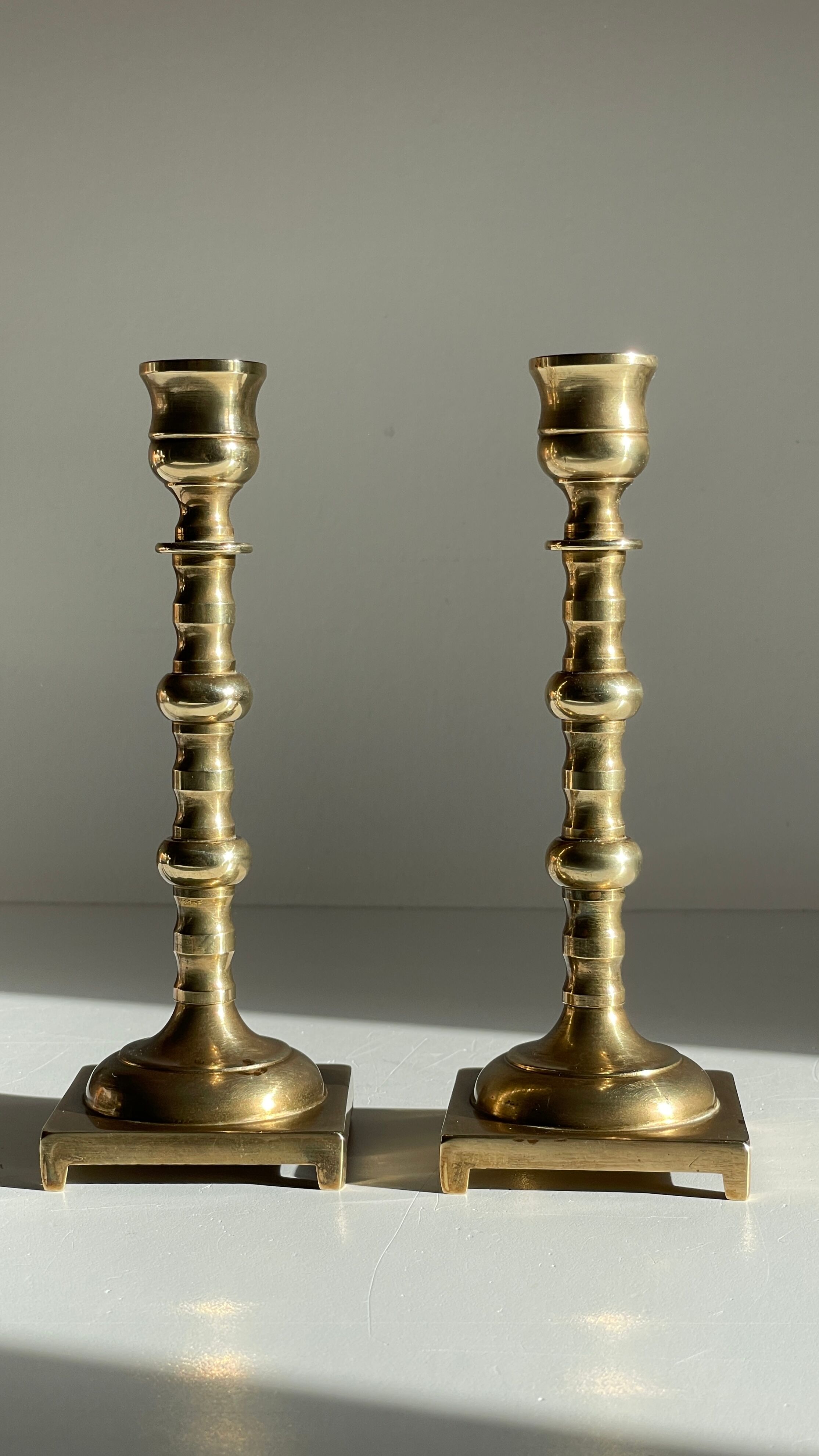Pair of brass candle holders made in England