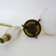 Pair of gooseneck wall sconces in gilded metal, white opaline with pink decorations
