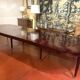 Directoire period extendable dining table in mahogany with a band.