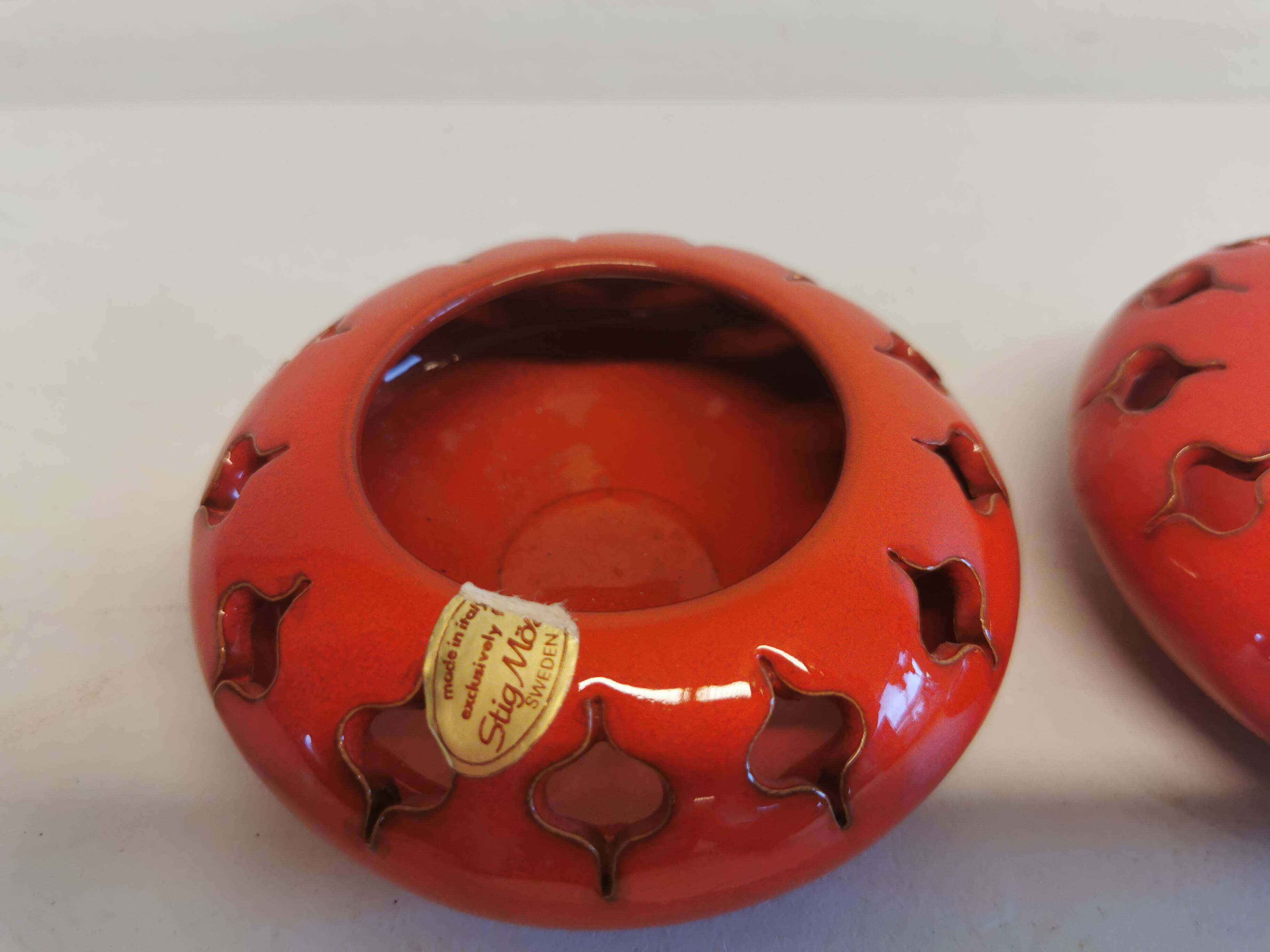 Pair of candle holders from the 1960s-1970s, crafted in red ceramic