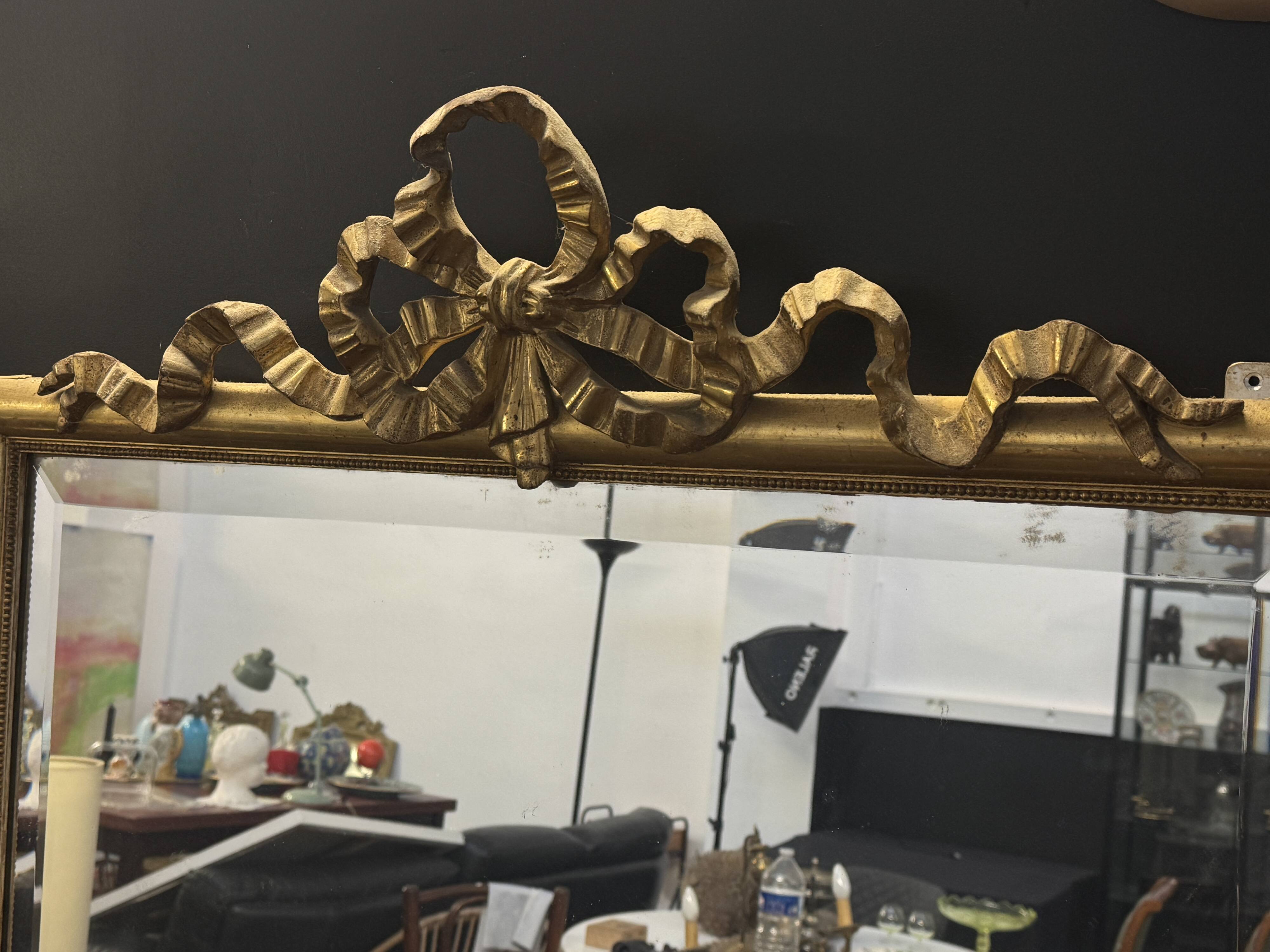 Large mirror with a gold frame