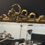 Large mirror with a gold frame