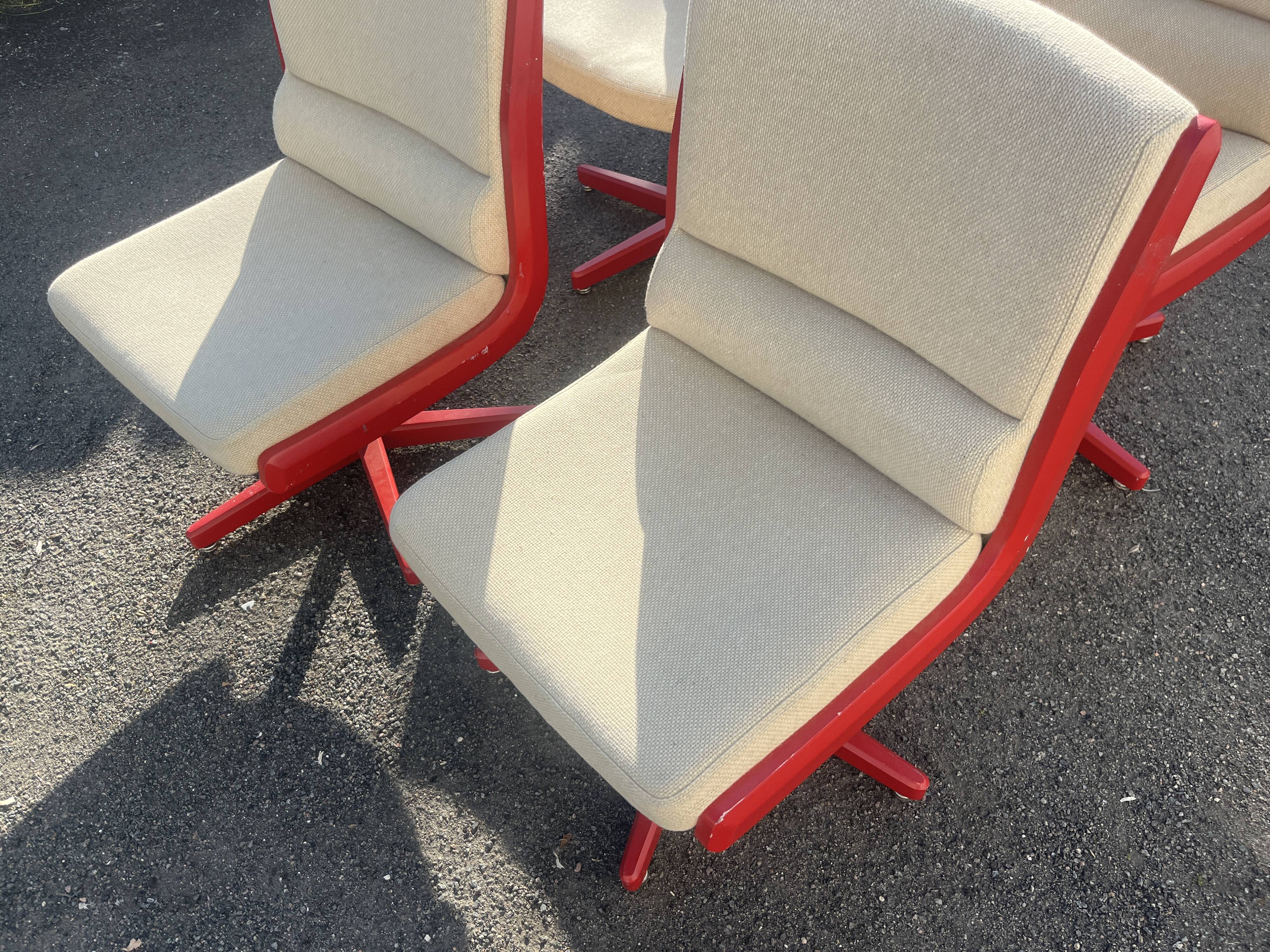 Set of 4 vintage 1970s swivel chairs in red and beige.