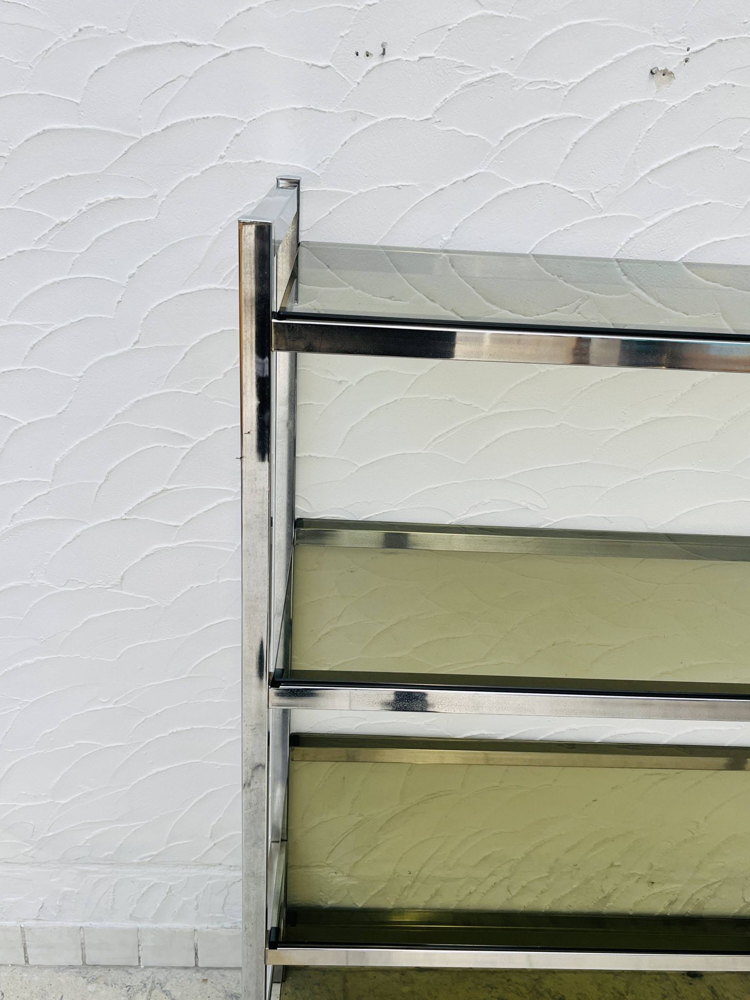 Chrome and smoked glass shelf in Italian 1970s style.