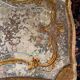 Louis XV style coffee table in carved wood with grey and gold highlights.