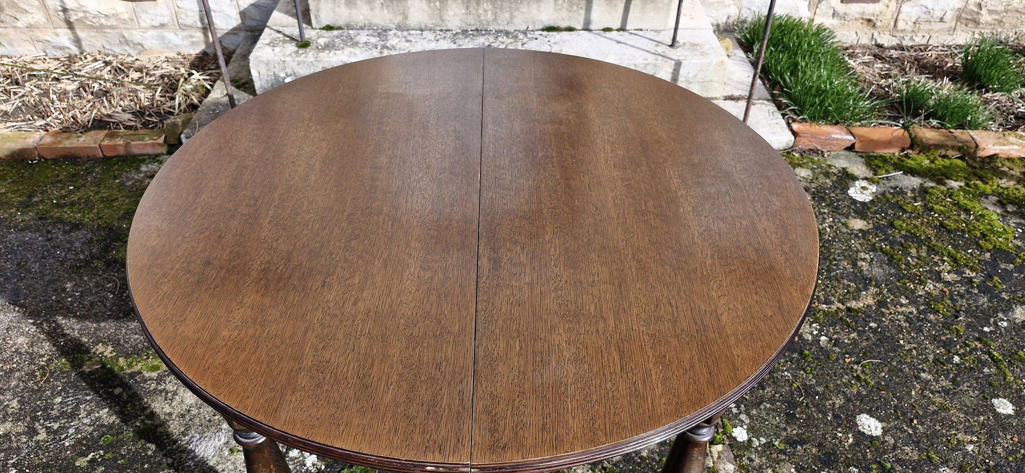 Round wooden table with 1 integrated extension + 6 wooden and fabric chairs