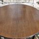 Round wooden table with 1 integrated extension + 6 wooden and fabric chairs