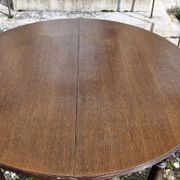 Round wooden table with 1 integrated extension + 6 wooden and fabric chairs