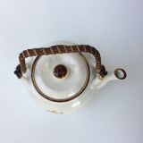 Vintage teapot with wicker handle