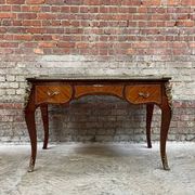 Antique French-style desk with green leather top and bronze mounts
