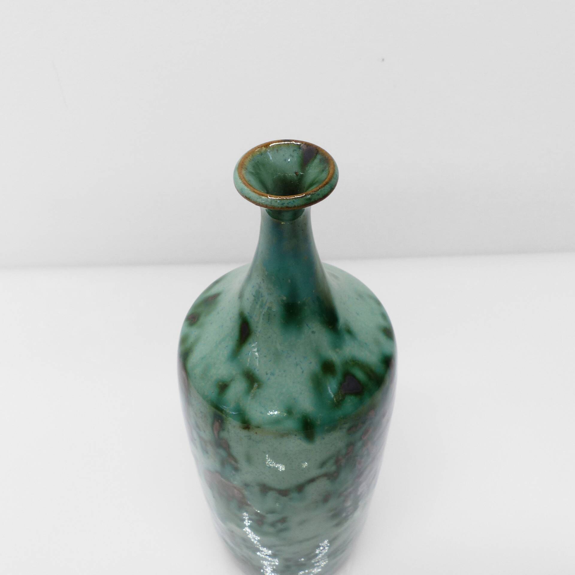 Green glazed stoneware bottle vase with copper highlights 1960-1970